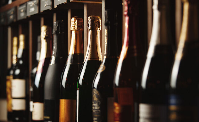 Variety of wine bottles on a shelf